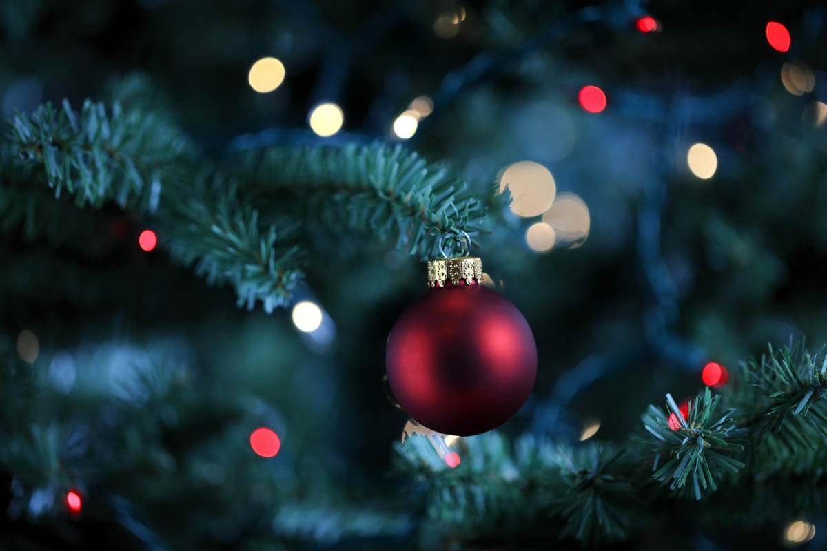 Close-up holiday ornament with soft bokeh lights, representing a professional holiday image